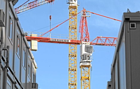 An Eiffage crane operates on a construction site in Asnieres-sur Seine, near Paris, France, on Friday, Feb. 6, 2009. Eiffage SA, France's third-largest construction company, said fourth-quarter revenue fell to 3.31 billion euros, from 3.59 biliion euros in the year-earlier period. Photographer: Fabrice Dimier/Bloomberg News